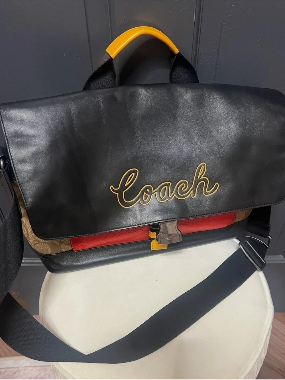 Coach Black Leather Messenger Bag with Red and Yellow Accents